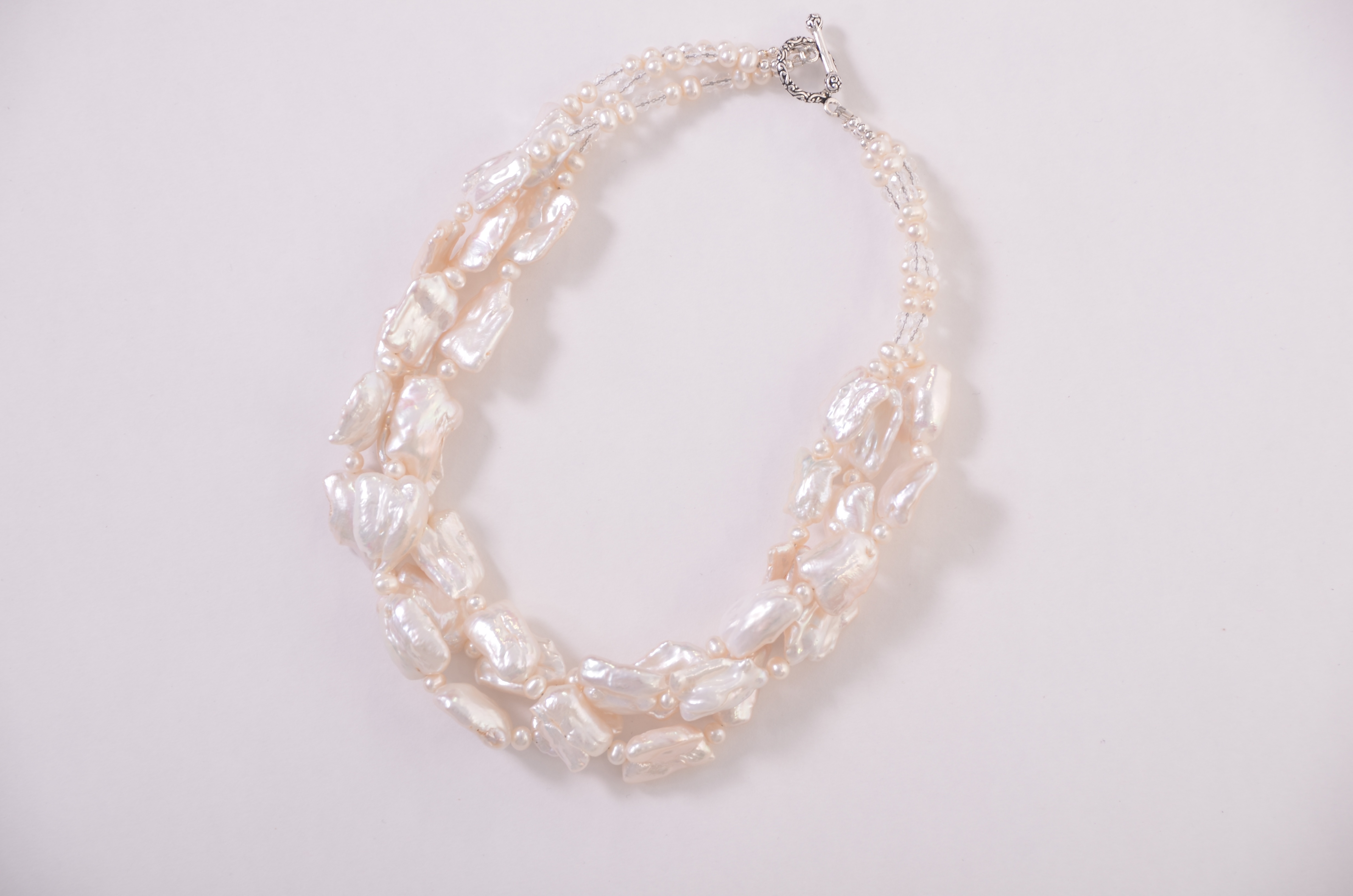 http://everyday-jewels.com/shop/white-freshwater-pearl-twist-necklace/