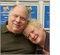 Photo of Barry Scheur of 'Gadgets' products and Kae of 'GuideLight' products sitting together smiling.