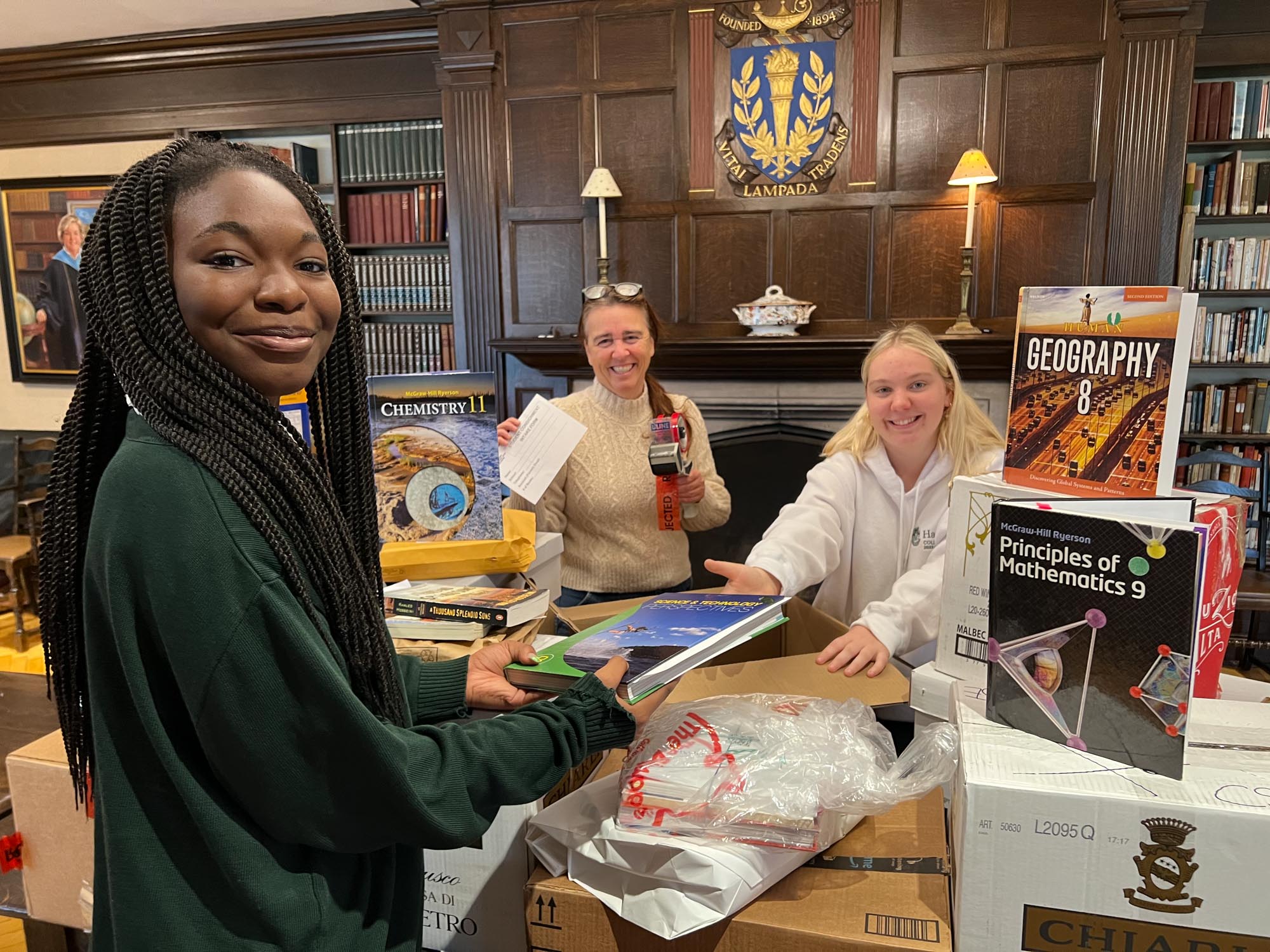 Student and volunteers at the Used Textbook Collection.