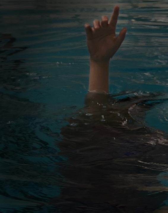 Photography of a hand reaching out of water.