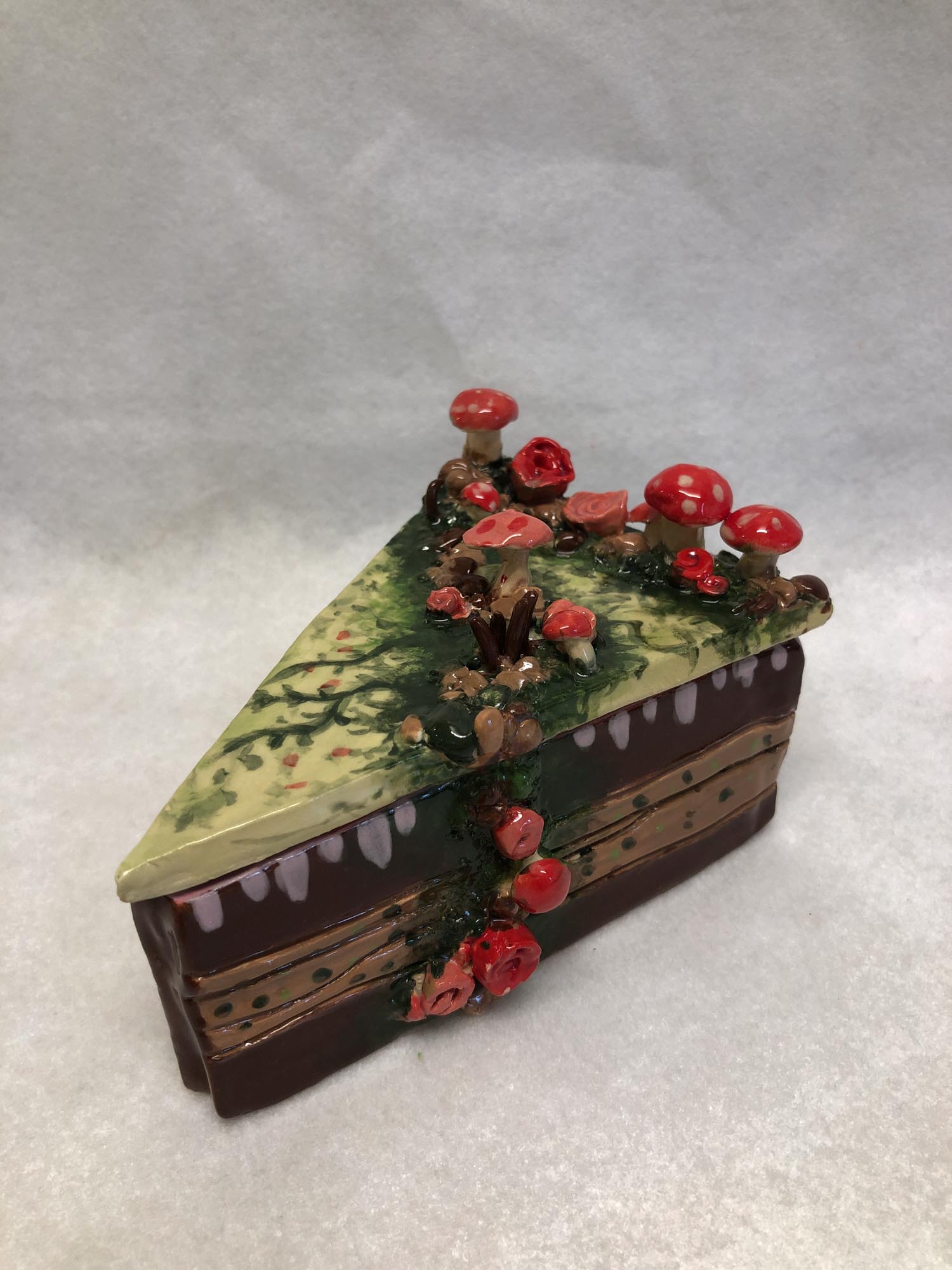 Photo of student artwork by Zoha I. in Grade 7 depicting a slice of cake made of clay
