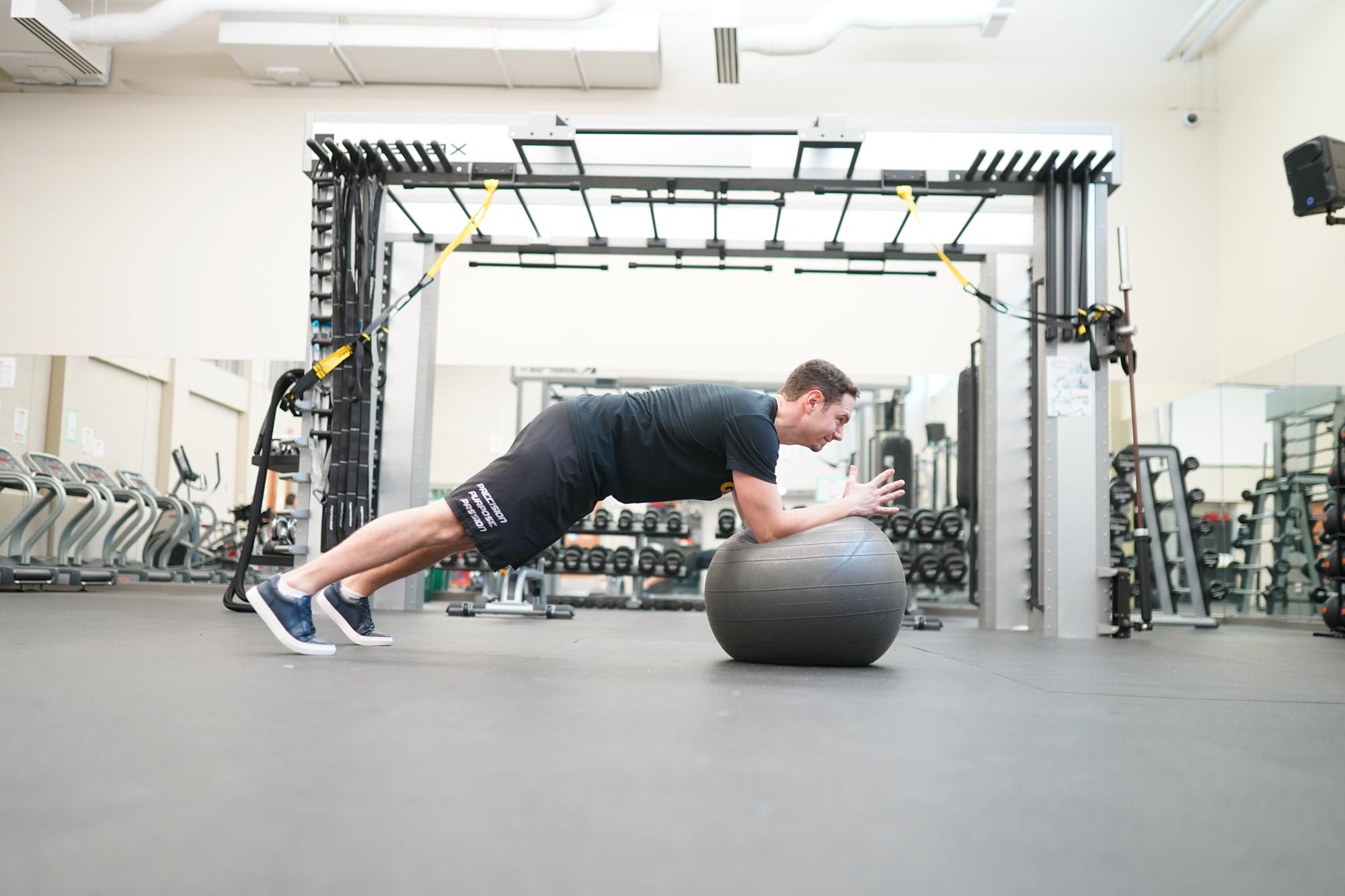 Havergal Strength and Conditioning Coach demonstrating pushups on a giant ball.