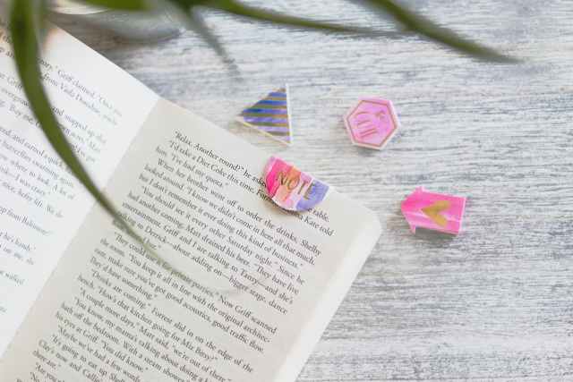 What do you buy a bookworm? - opened book with pink note bookmark