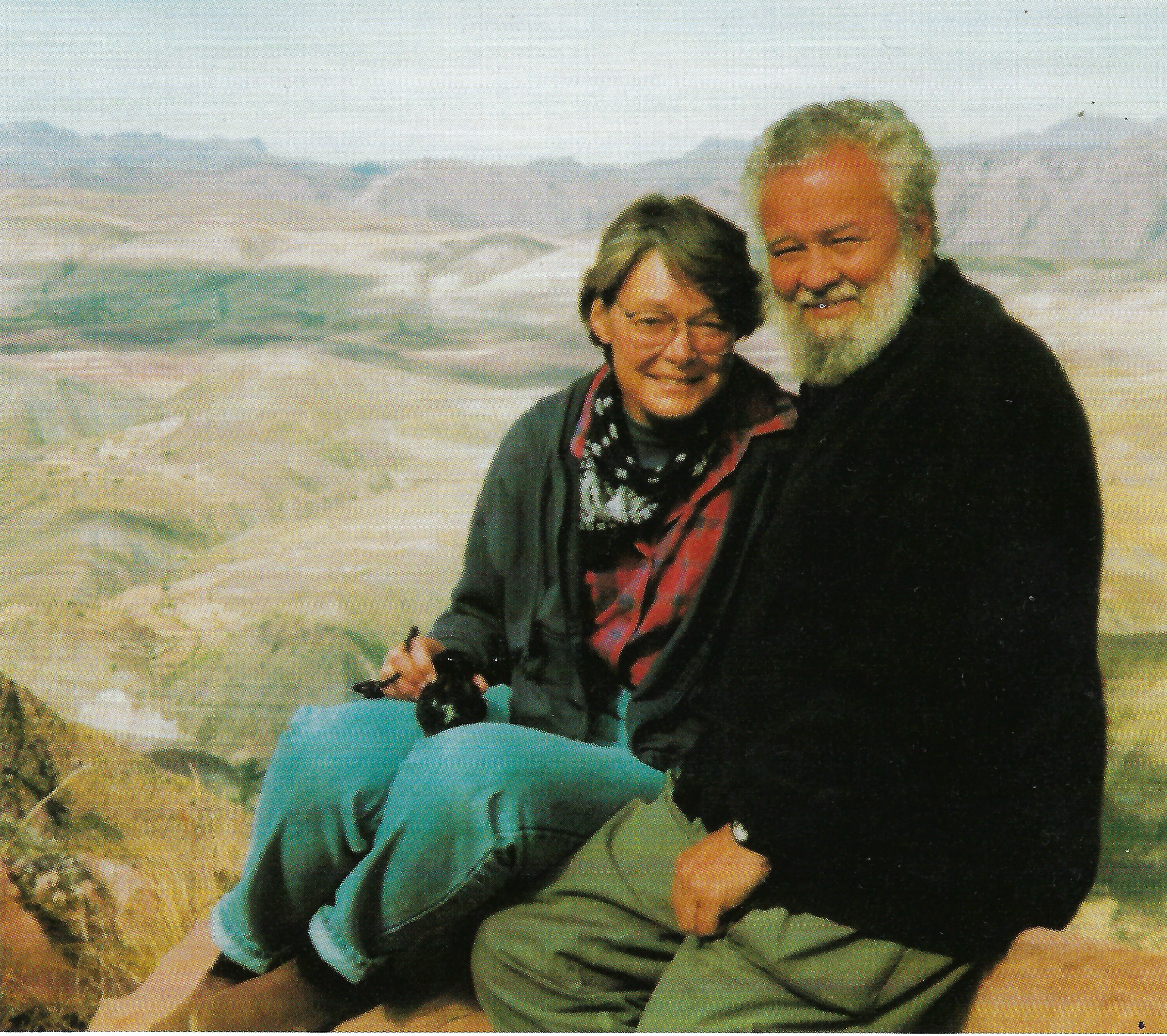 Tom and Sherry Wilson seated on a ridge in the Bolivian Andes