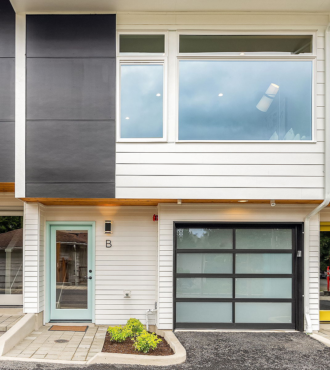 Shoreline Townhome Builder - modern kitchen and open concept living area
