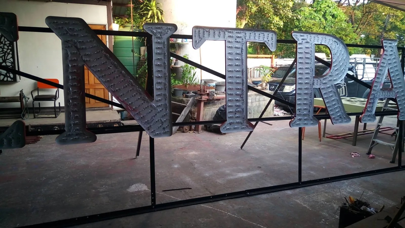 Central letters in the workshop - sign by Thai Prasith Signtech