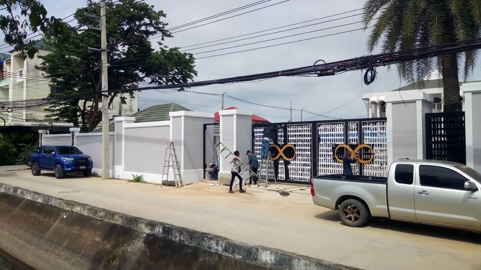 Perforated steel gates - sign by Thai Prasith Signtech