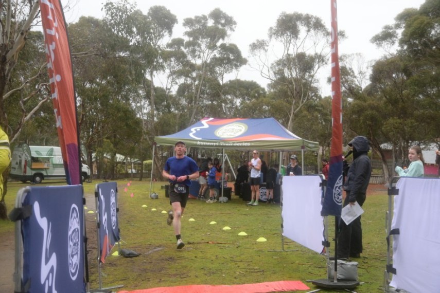 Joseph running through finish line