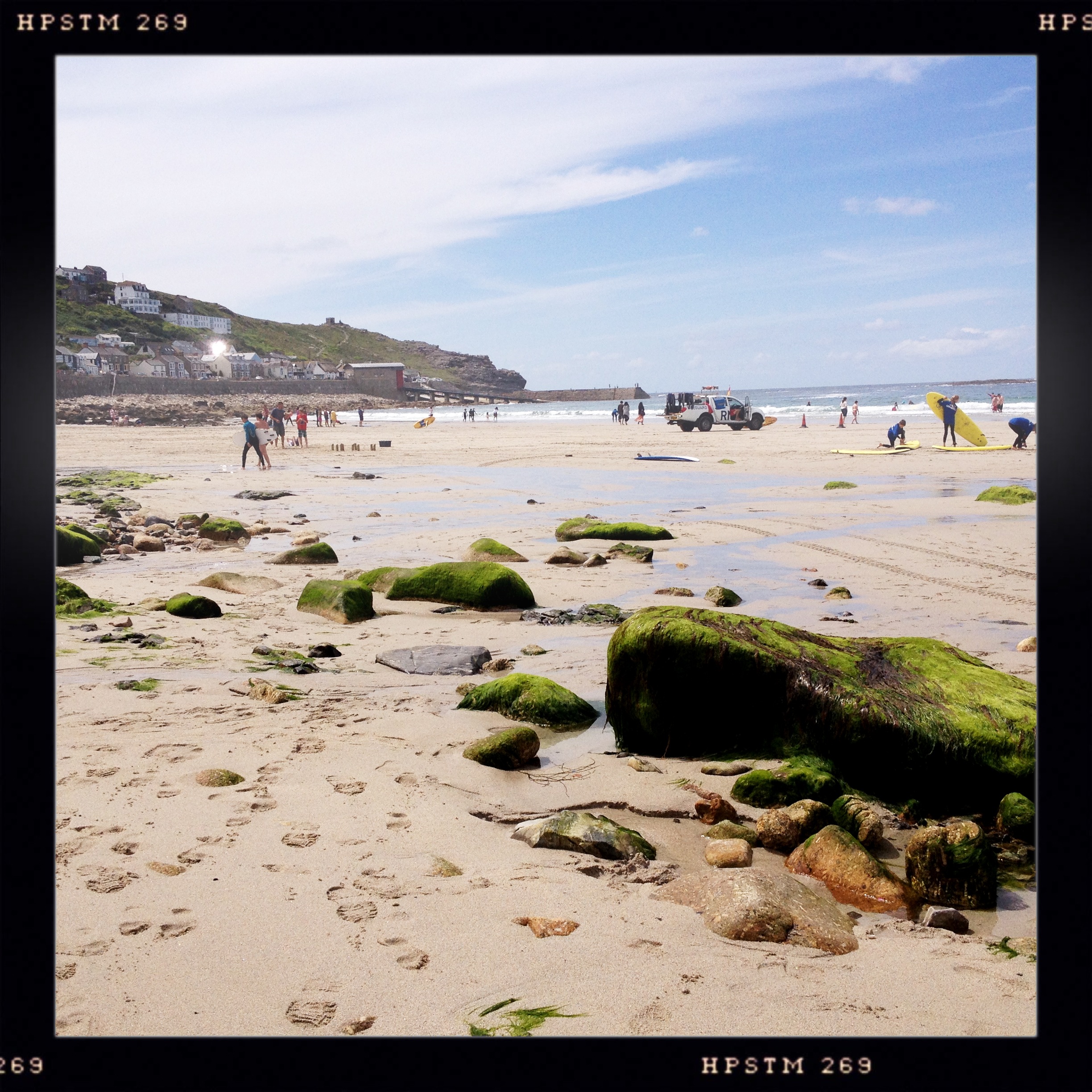 Surfers braving the cold waters at Sennen Cove.