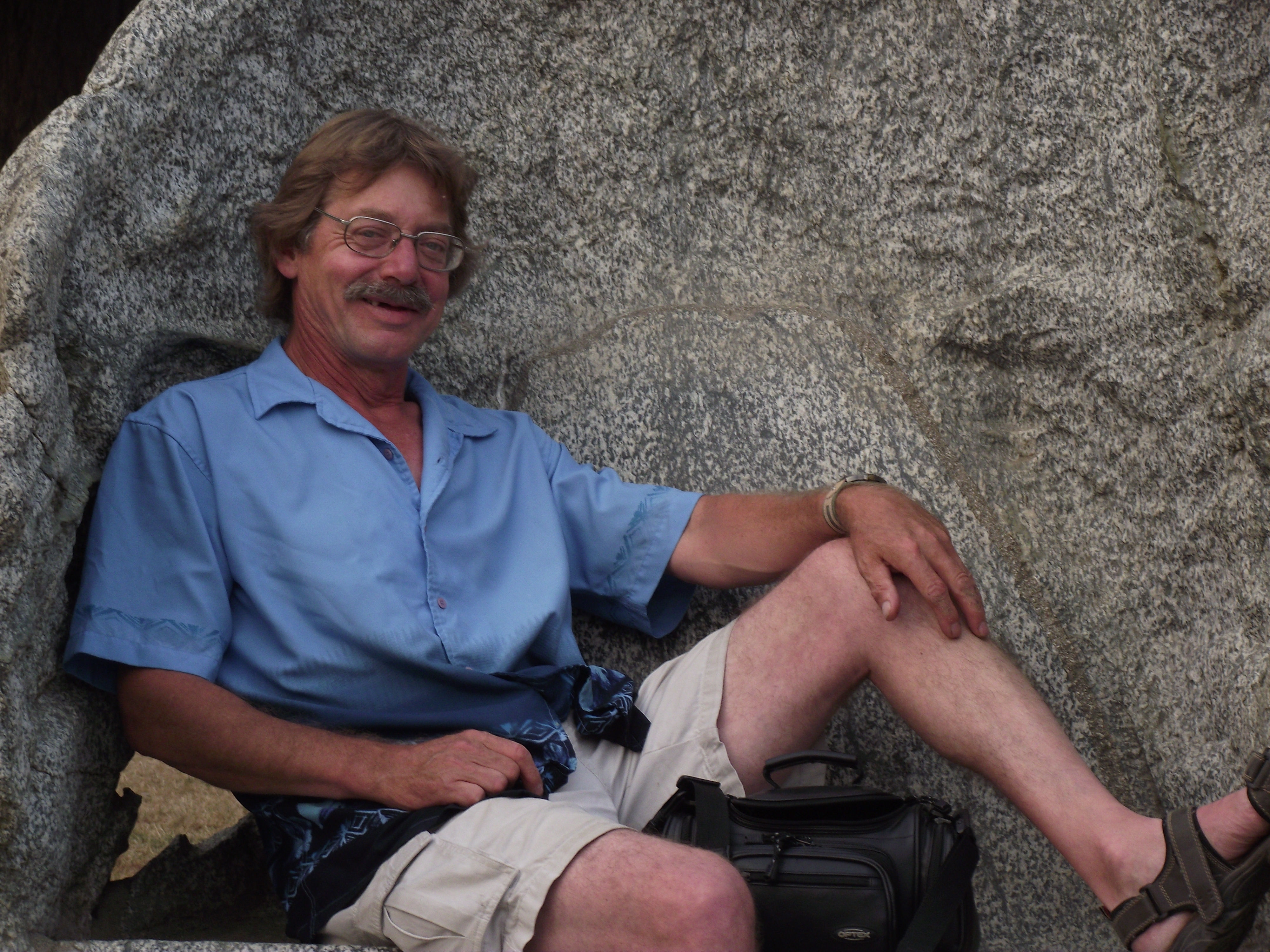 Ken on naturally formed rock