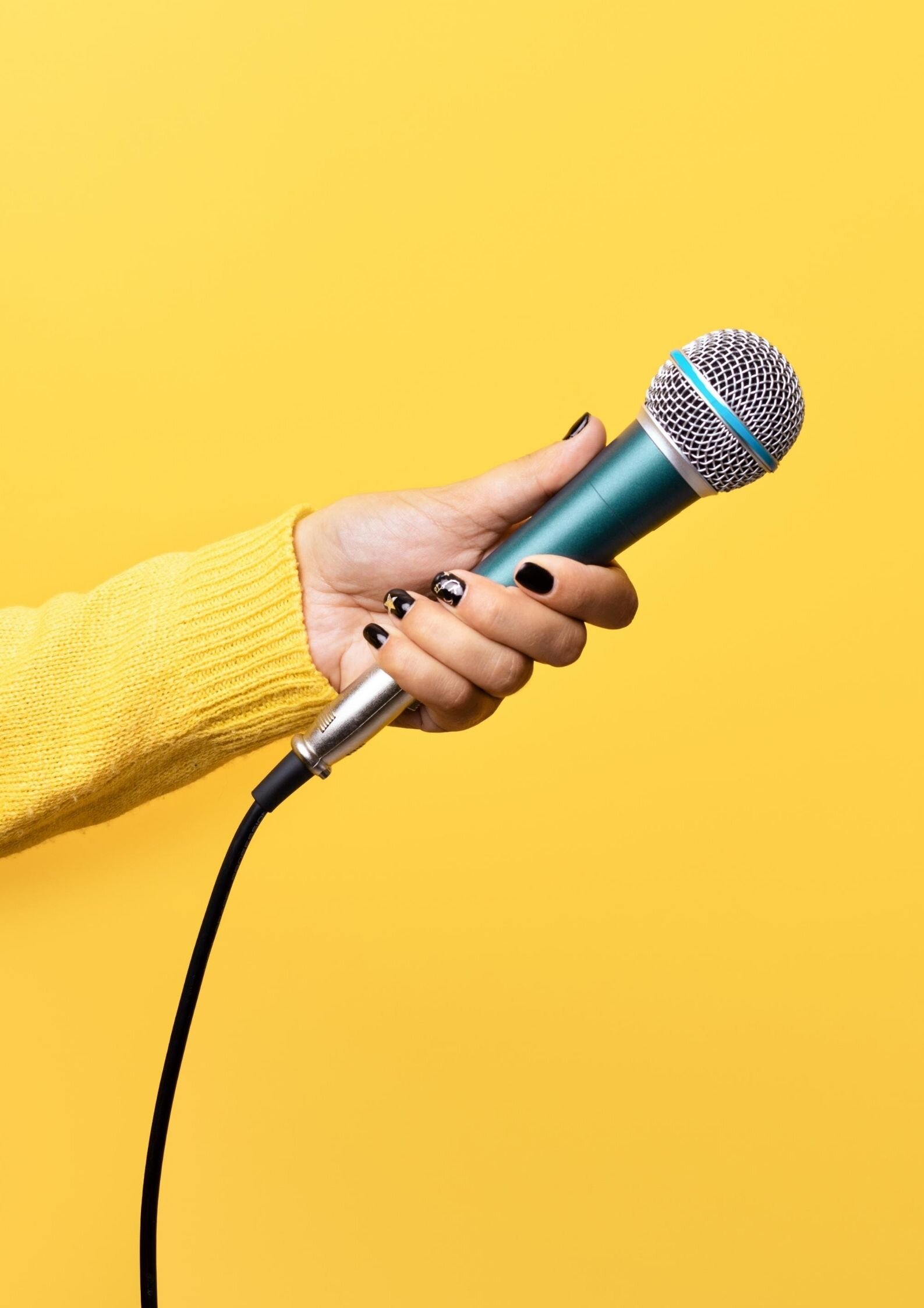 Hand holding microphone