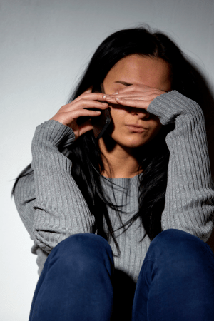 Woman shielding her eyes