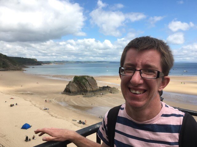 Alex Lloyd near a beach