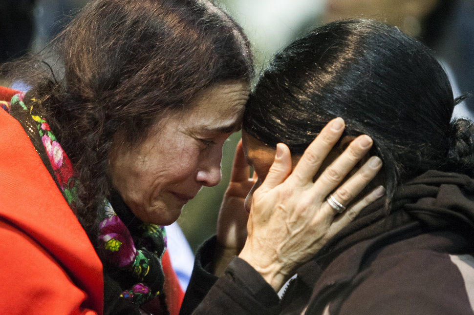 Maria D. Michael, a Lakota elder from San Fransisco, Calif., embraces veteran Tatiana McLee during an emotional forgiveness ceremony at the Four Prairie Knights Casino & Resort on the Standing Rock Sioux Reservation on Monday, Dec. 5, 2016.