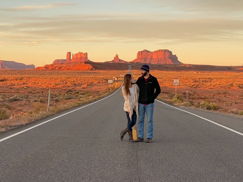 Sara and Tim enjoying an iconic sunrise at Forrest Gump Point near Monument Valley