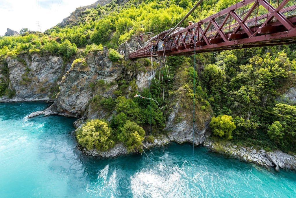 a person bungee jumping from the Kawarau Gorge Suspension Bridge, located near Queenstown, New Zealand.