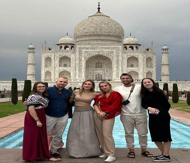 Travelers from USA at Taj Mahal during 4 days Golden Triangle tour