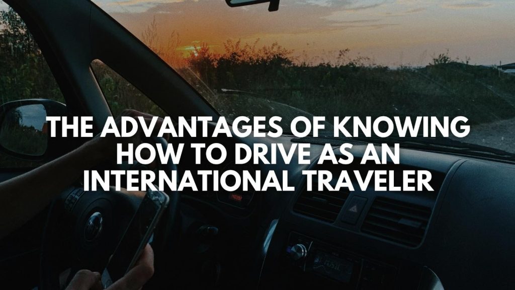 Text "The advantages of knowing how to drive as an international traveler" over a view from inside a car driving at sunset.