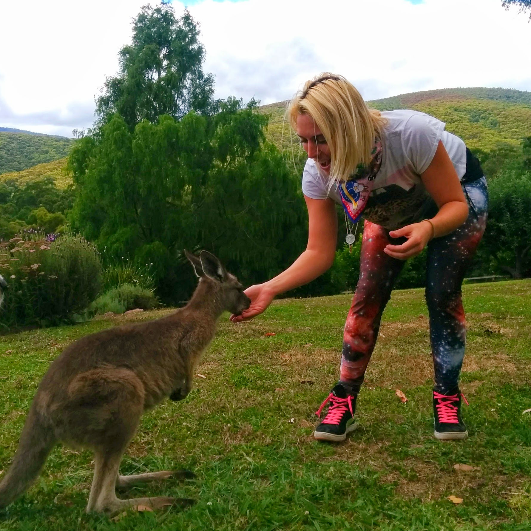 girl petting kangaroo