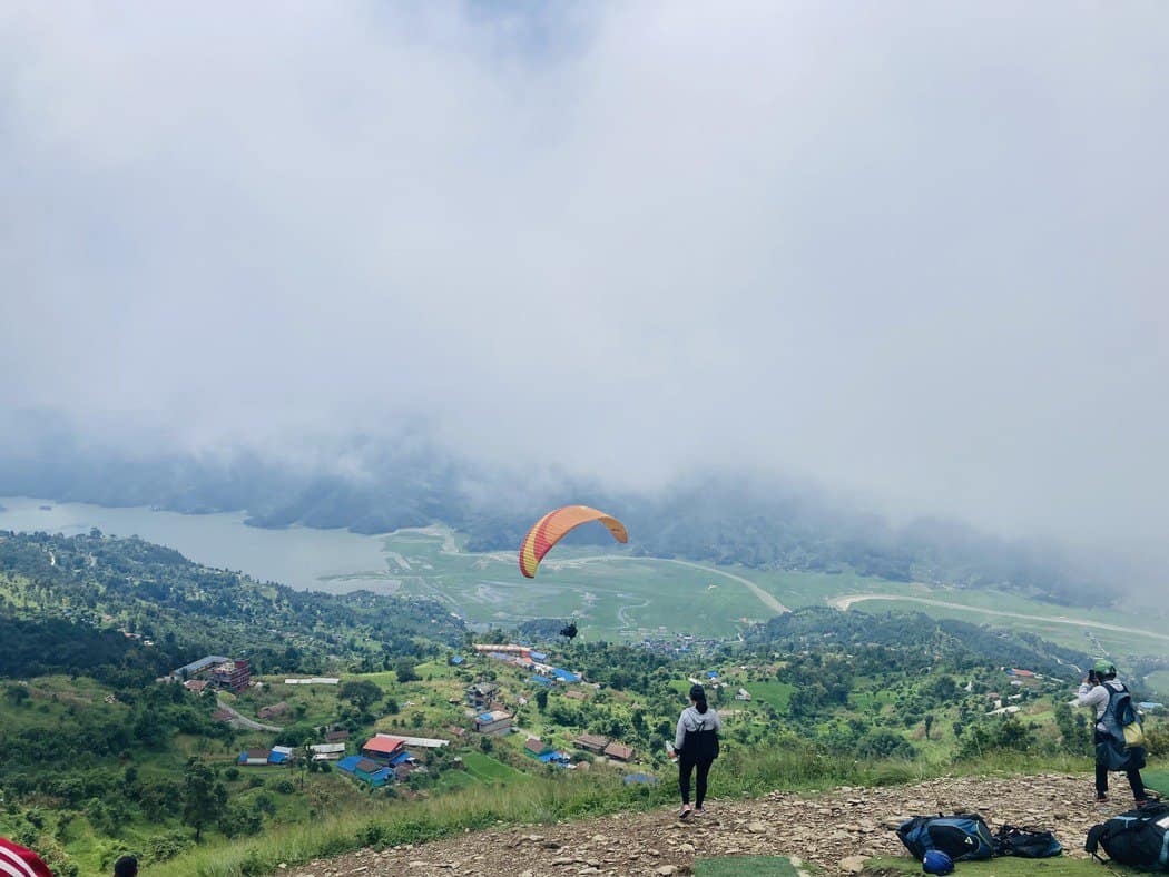 People paragliding in Pokhara, Nepal.
