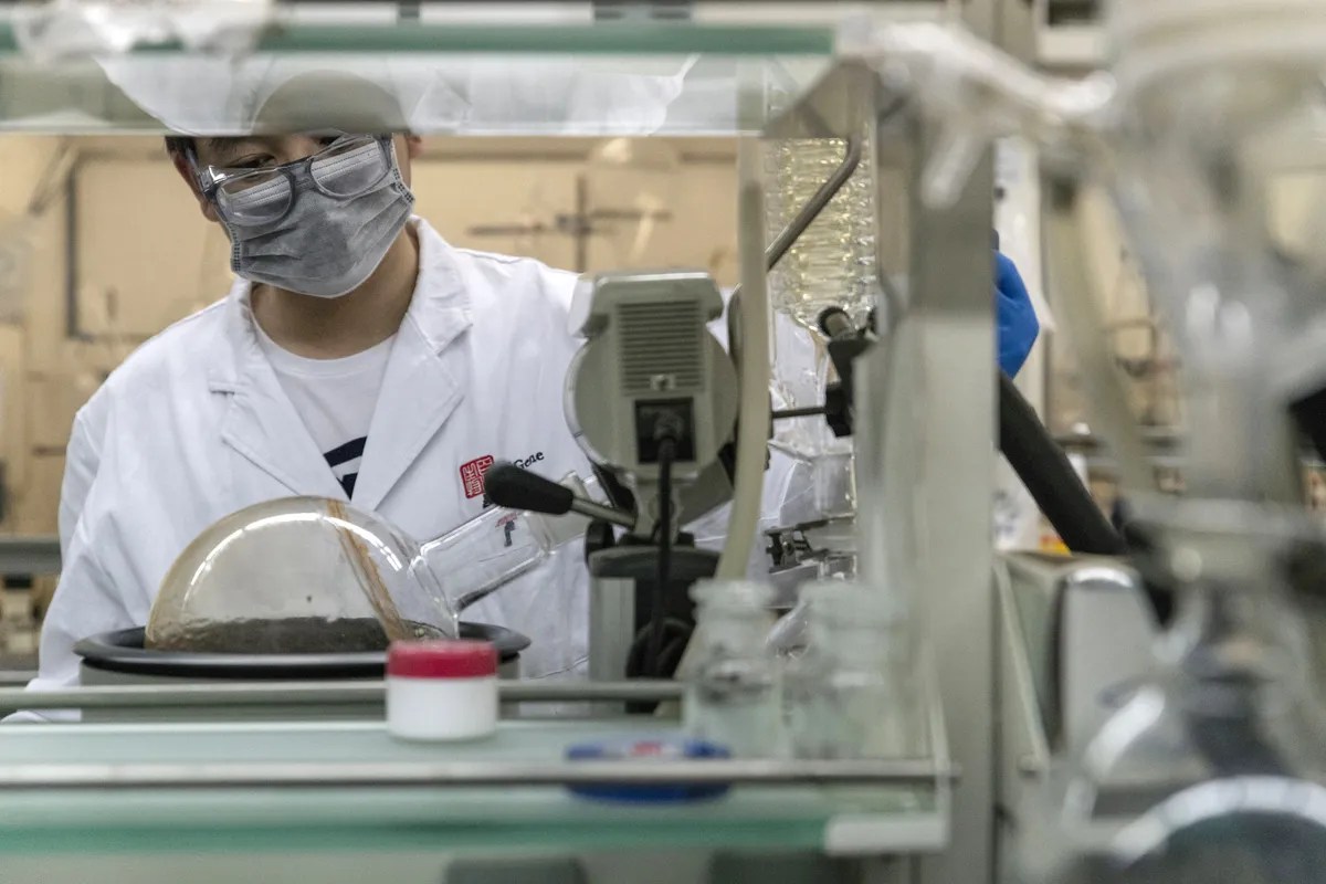 Asian scientist conducting research and representing advancements in science and technology in Asia.