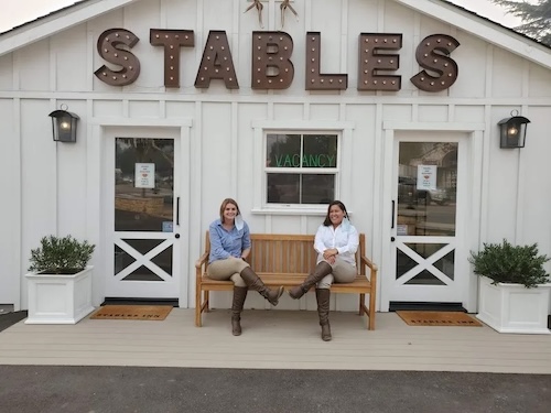 Staff members in front of the Stables Inn