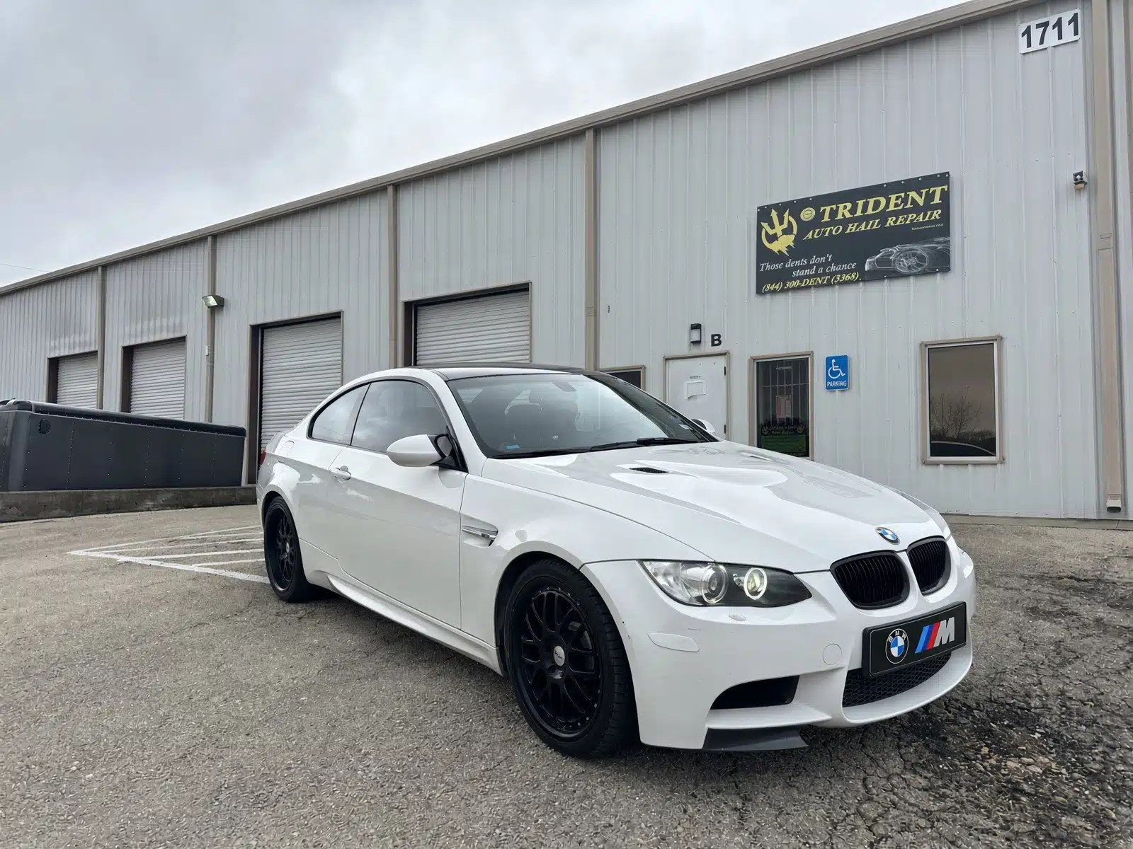 White BMW M Series in front of Killeen Shop