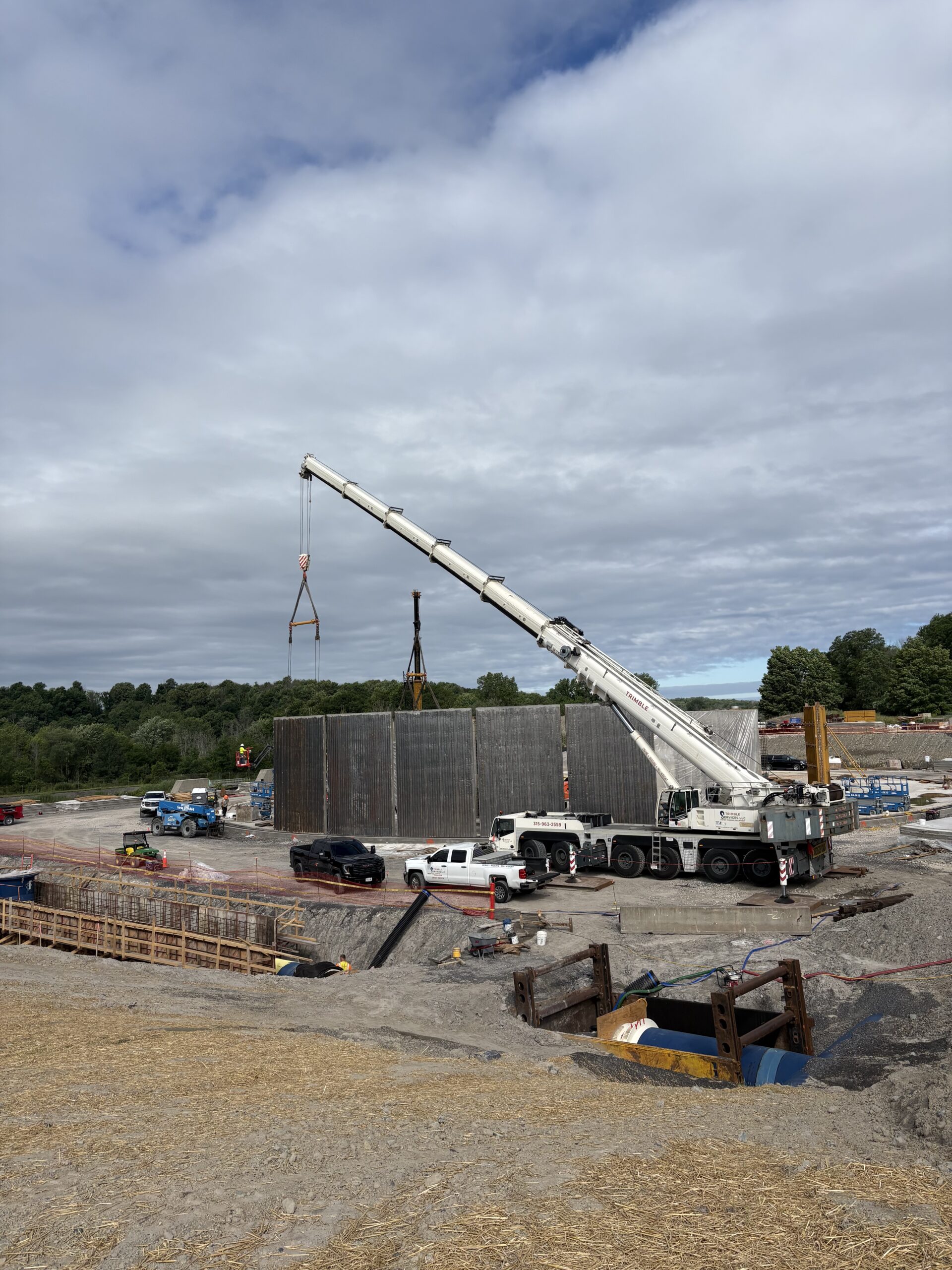 Wide view of Trimble Services erecting precast concrete panels for a 5.5-million-gallon water tank project in Oswego, NY.