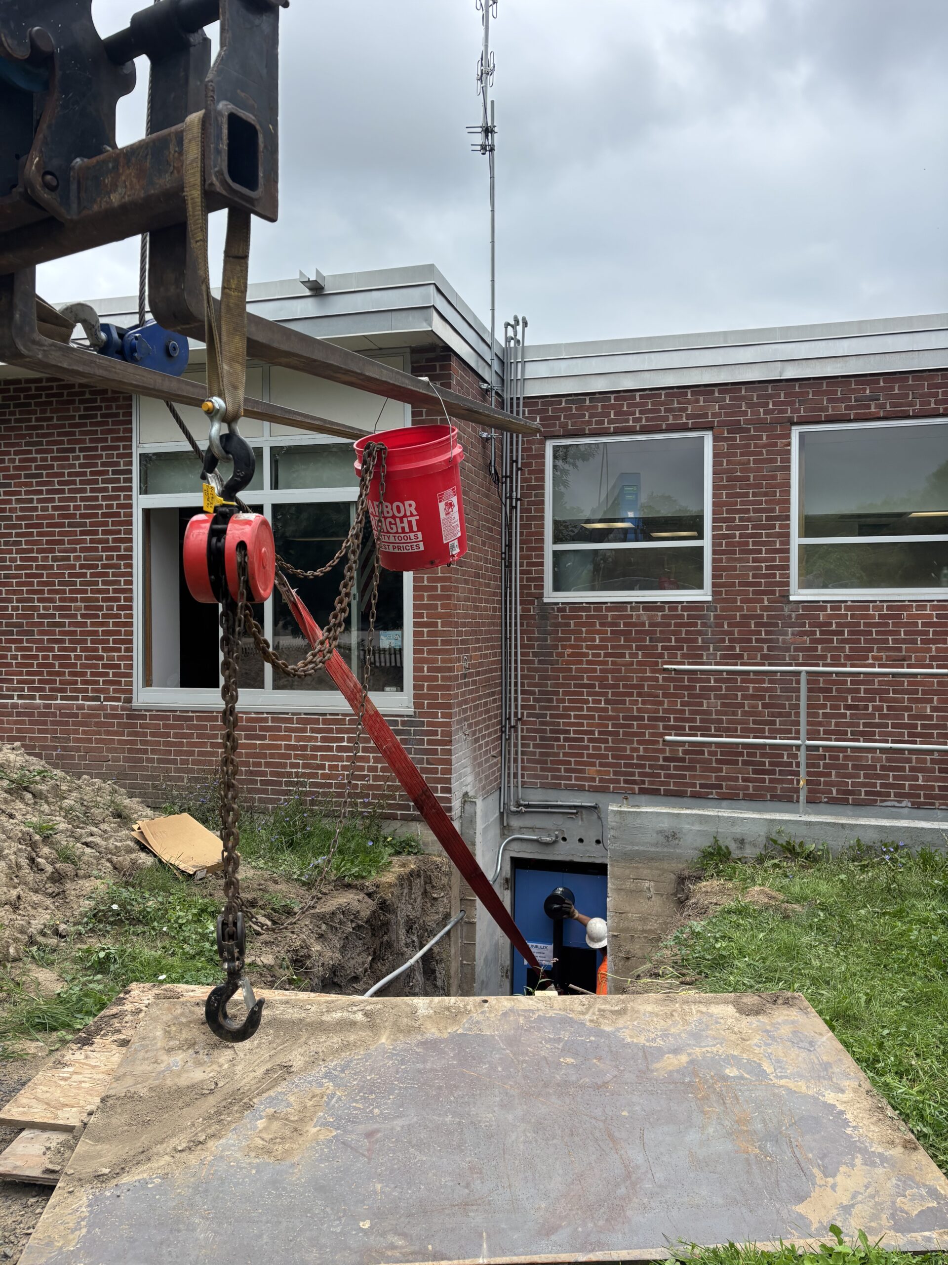 Rigging setup used to move a 4,000-pound boiler through the basement access at Starbuck Elementary.