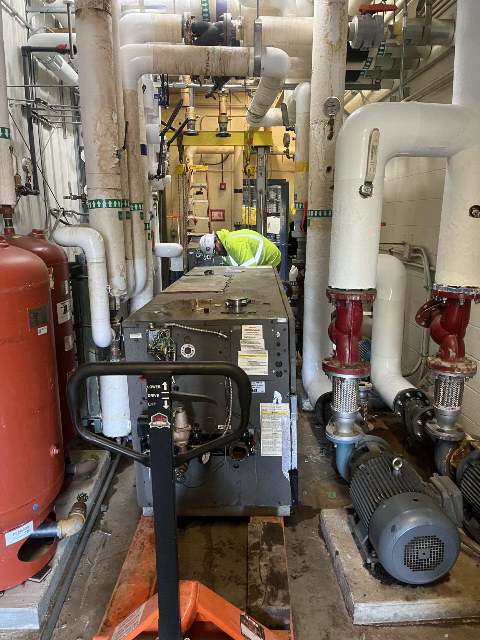 Replacement boiler installed among existing mechanical room piping