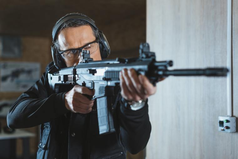handsome-man-aiming-rifle-in-shooting-range.jpg handsome-man-aiming-rifle-in-shooting-range.jpg