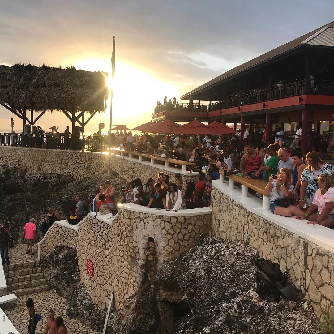 Crowd at Rick's cafe Jamaica which is one of the top things to do in Jamaica