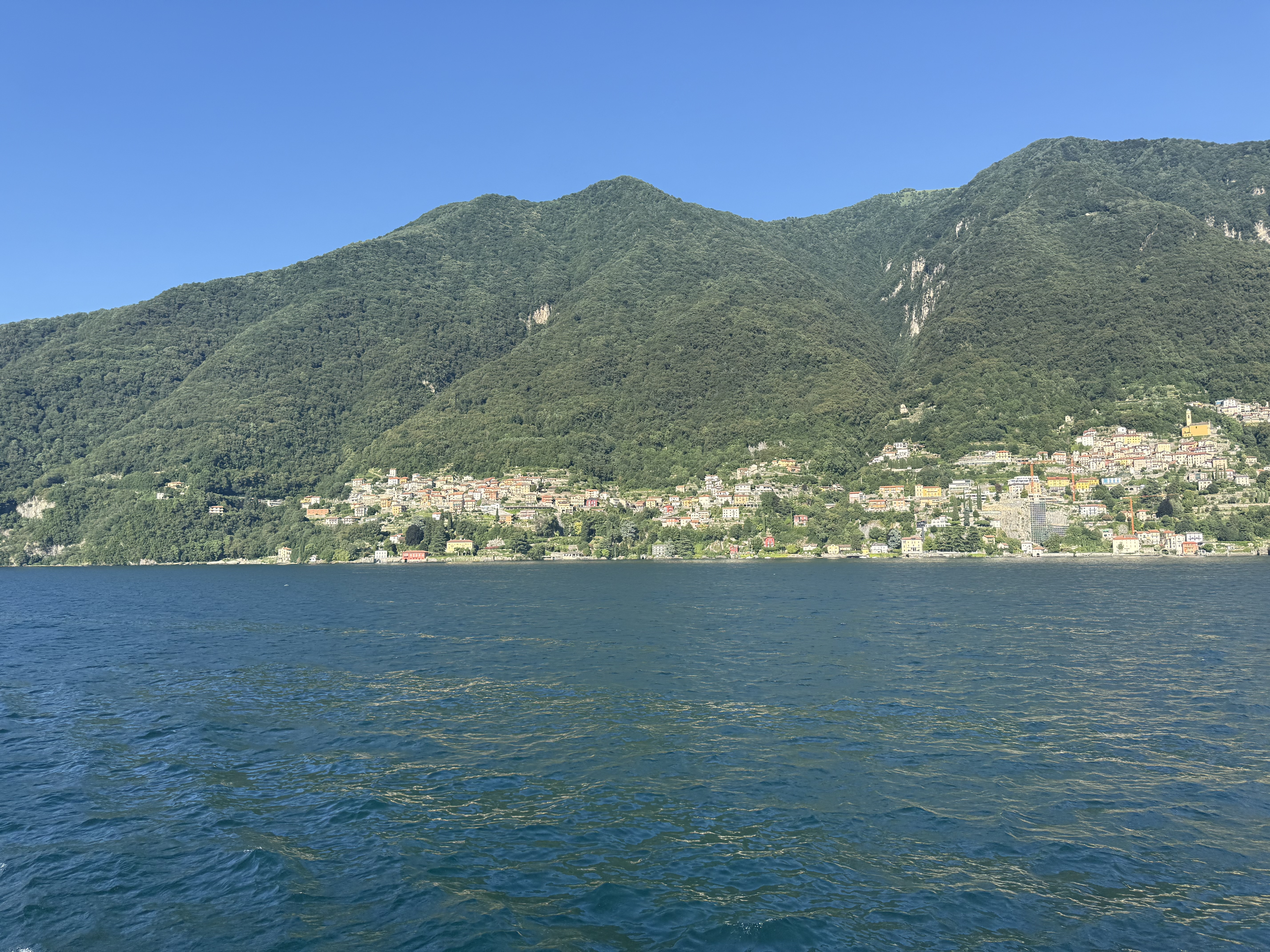 Lake Como waterfront framed by mountains and lakeside villages