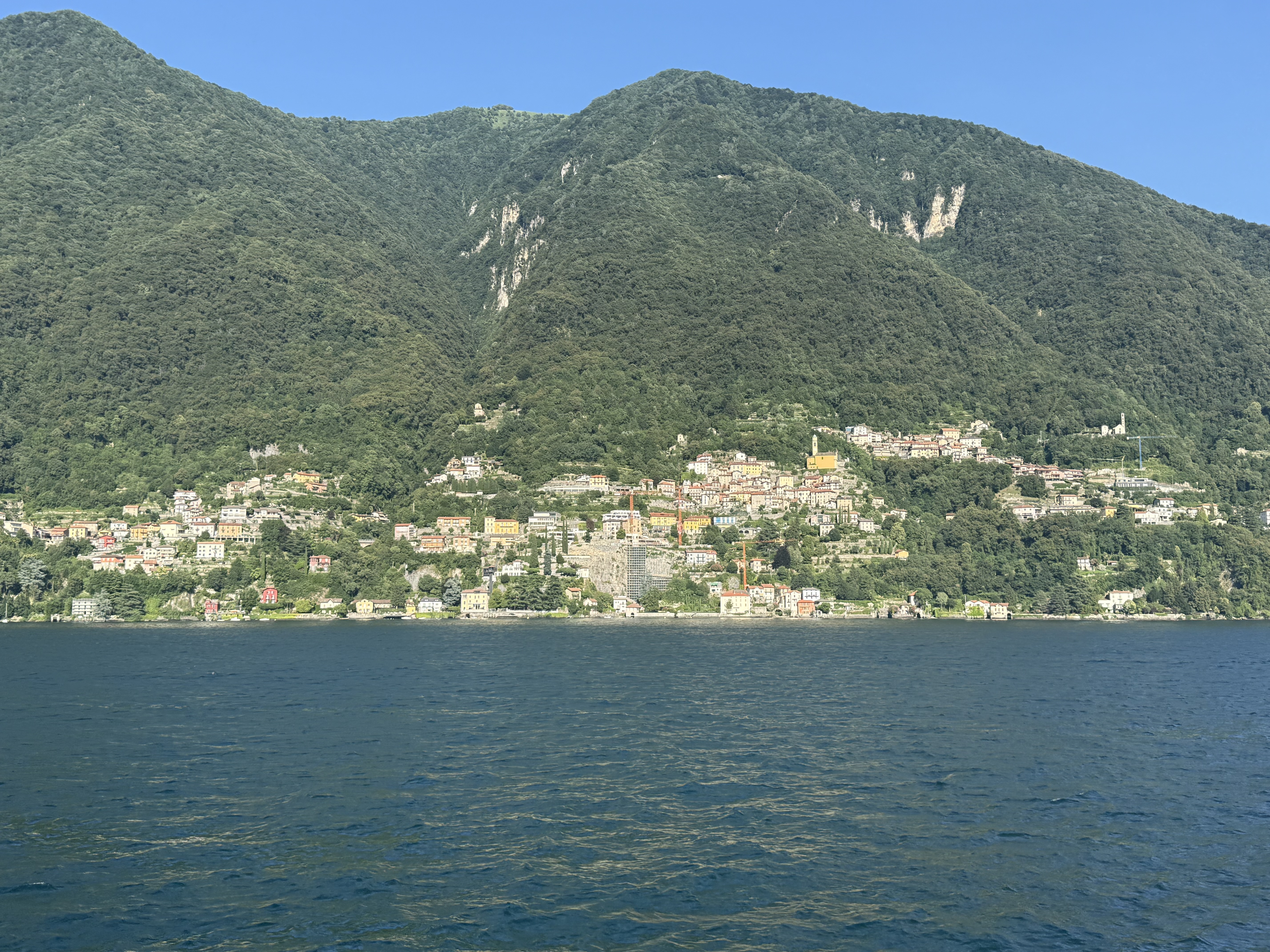 Lake Como village and green hills across the water