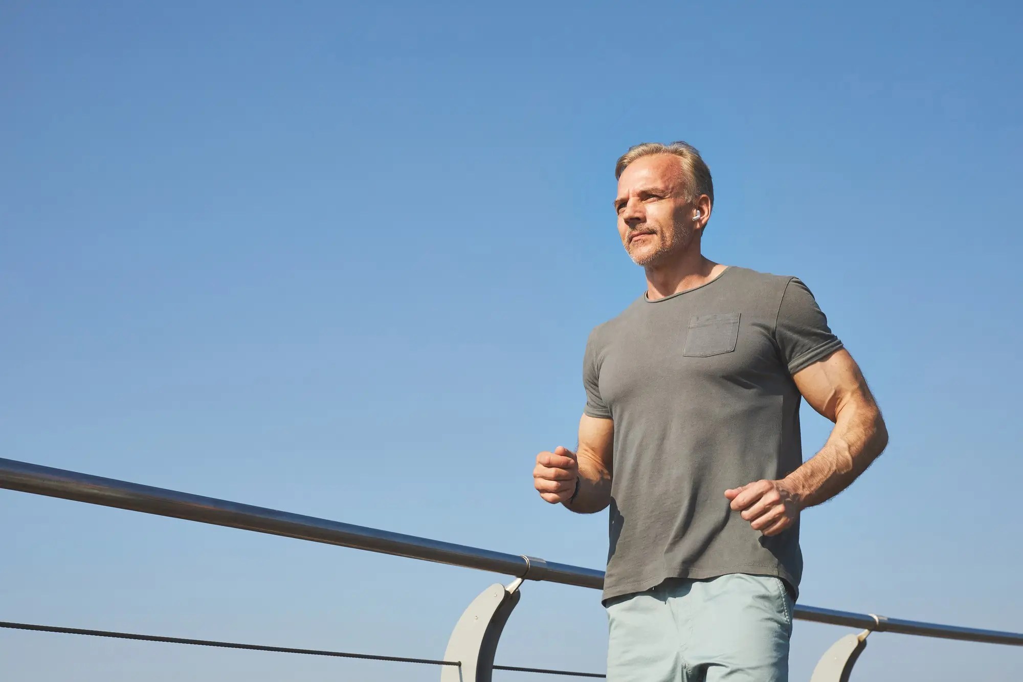 Fit man running outdoors