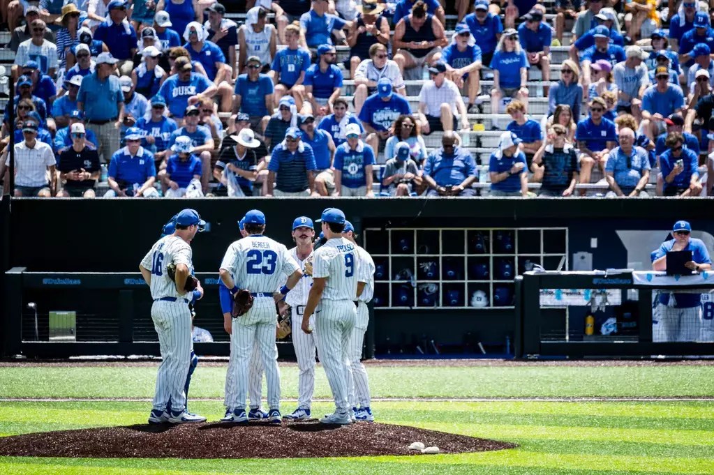 Duke baseball team huddle during home game