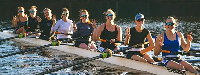 Duke rowing team celebrating on water after race