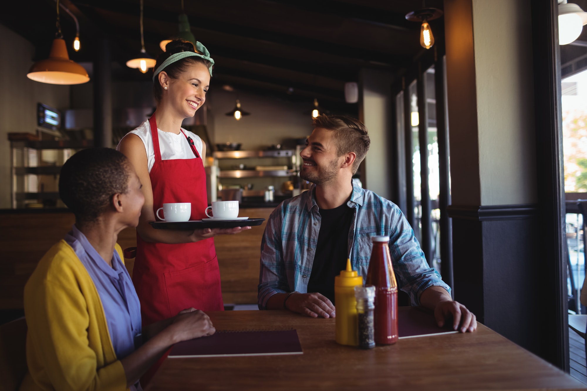 Waitress interacting with customer