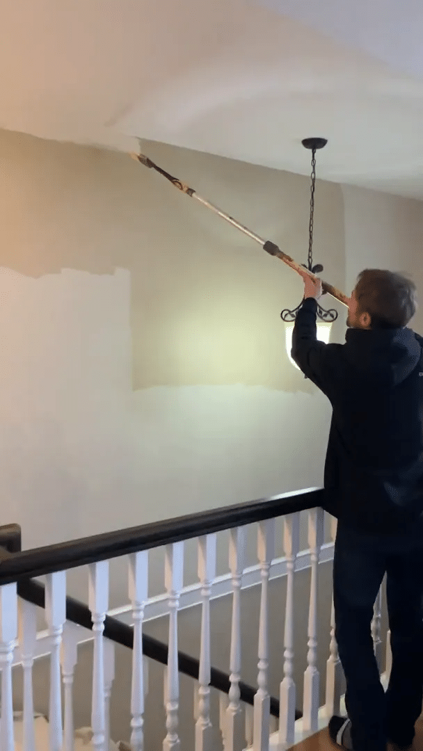 Cutting in a thick line along the top edge of the wall