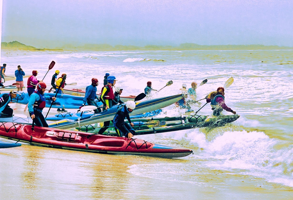 Racers enter the surf