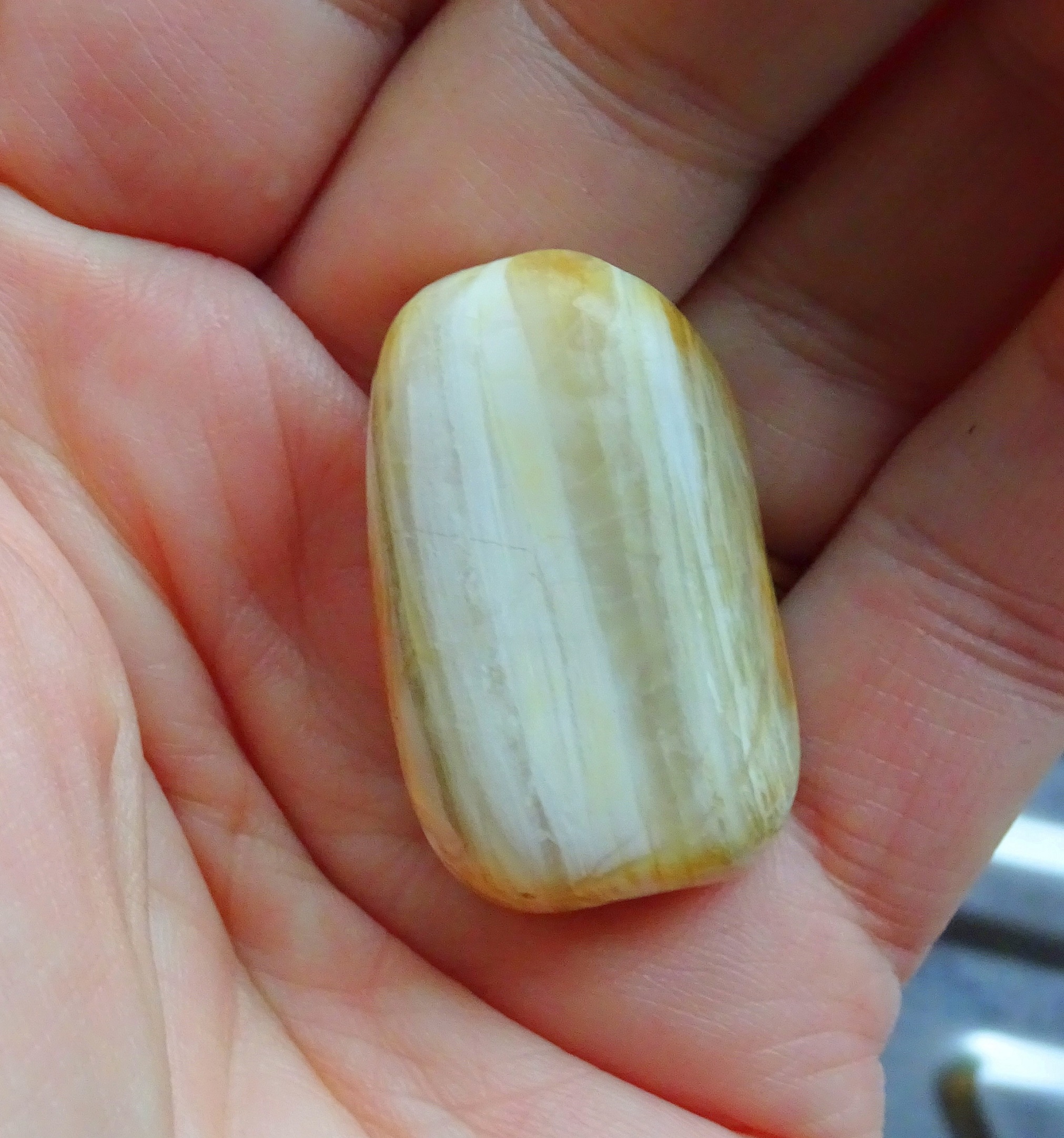 The stained stone after tumbling for a week in 220 grit - it looks like agate