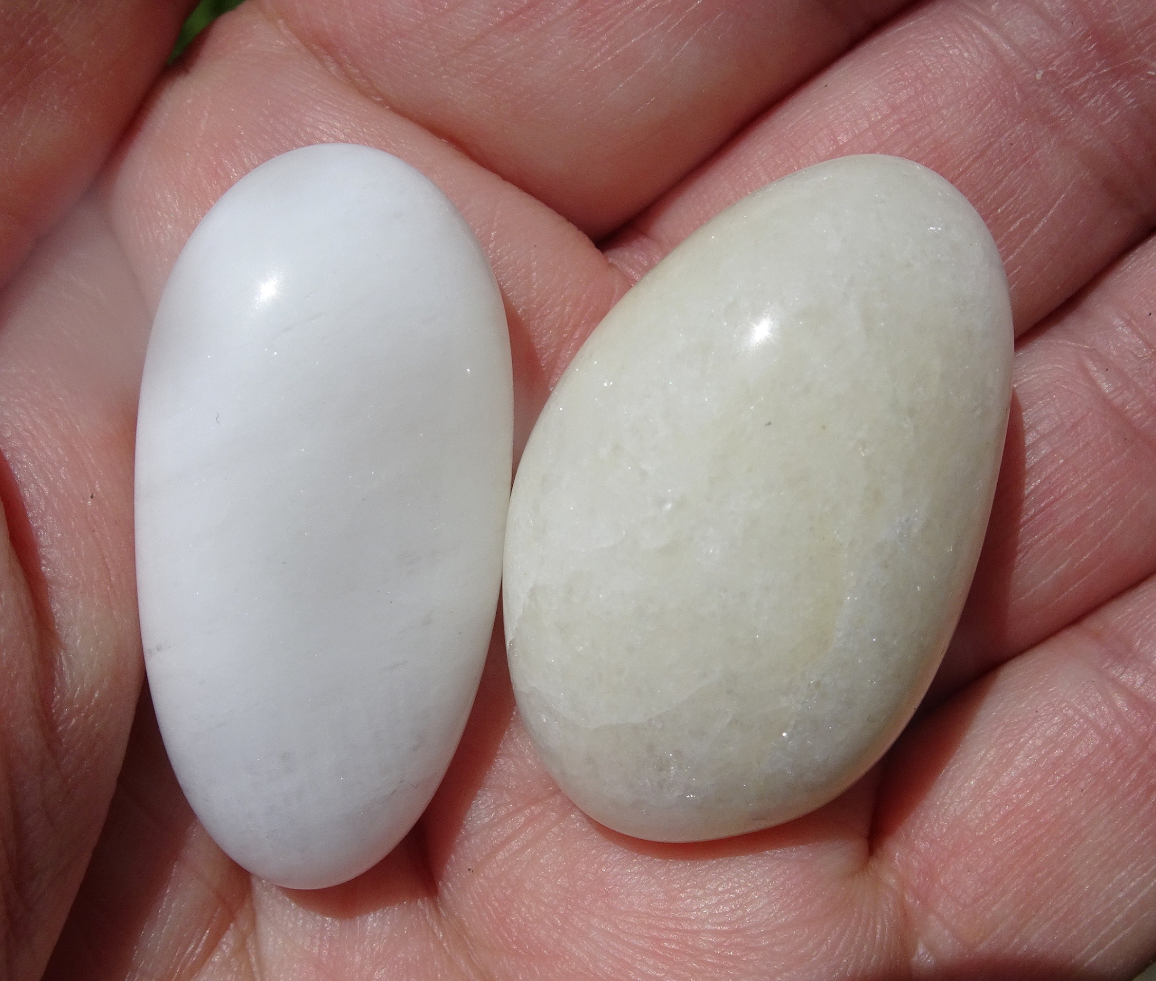 Two quartz stones, one slightly iron-stained.