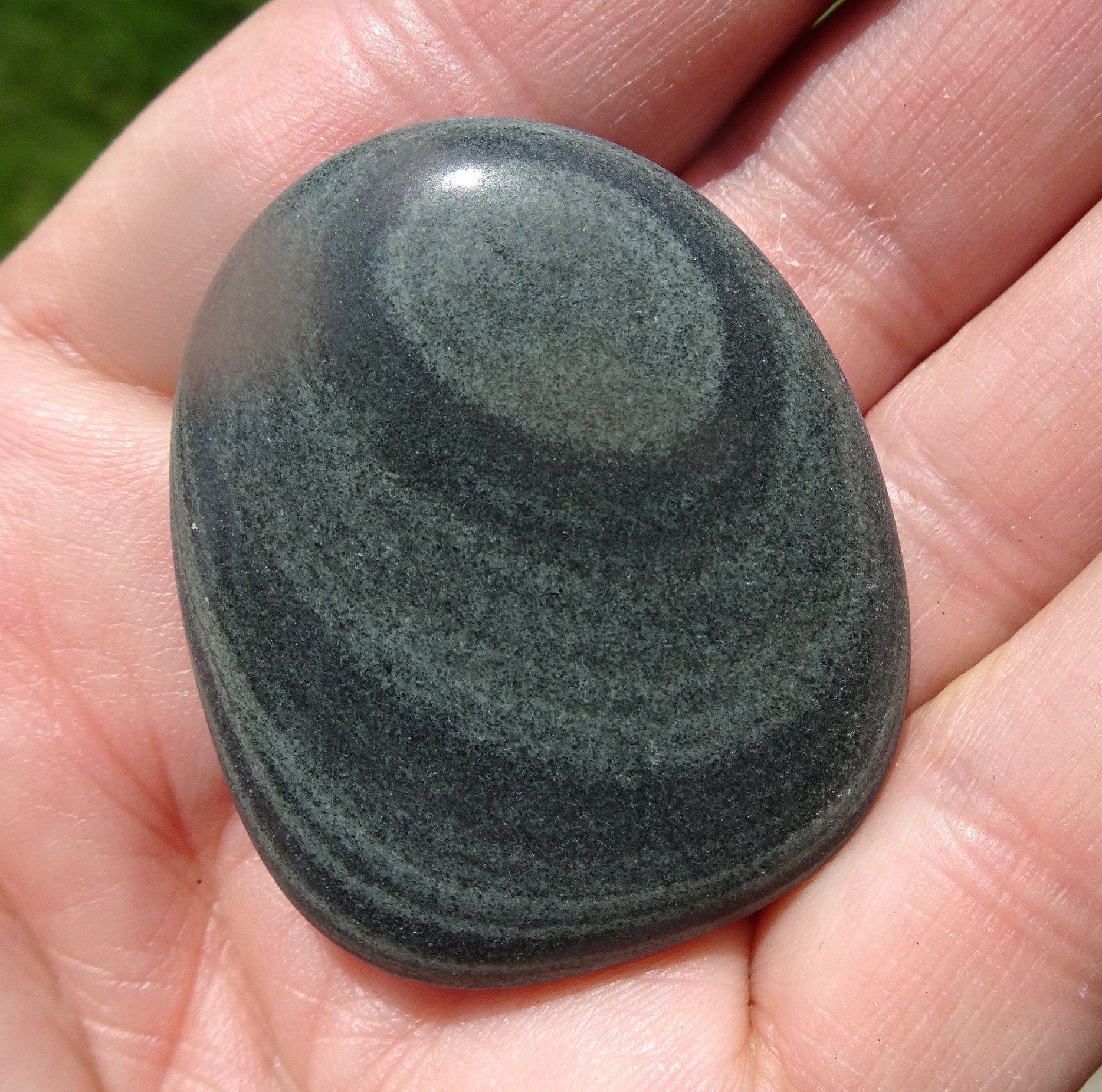 Bands of gray make up this stone.