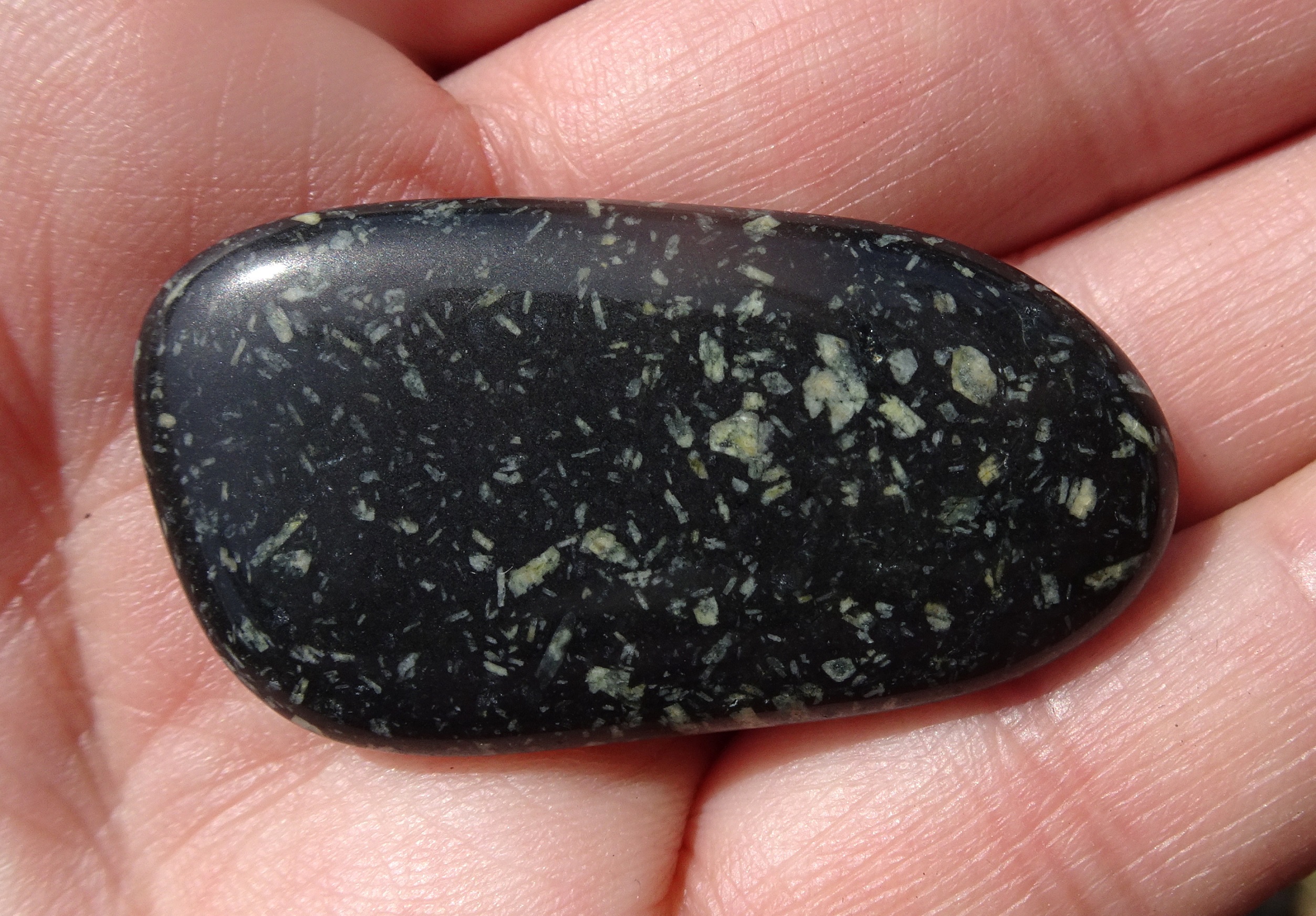 Volcanic stone, the white specks being crystals that form as the rock cooled.