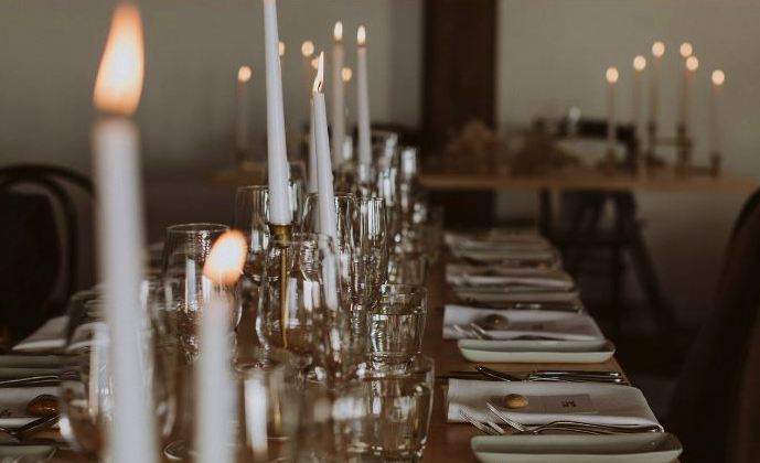 Stones on name cards on table at wedding.