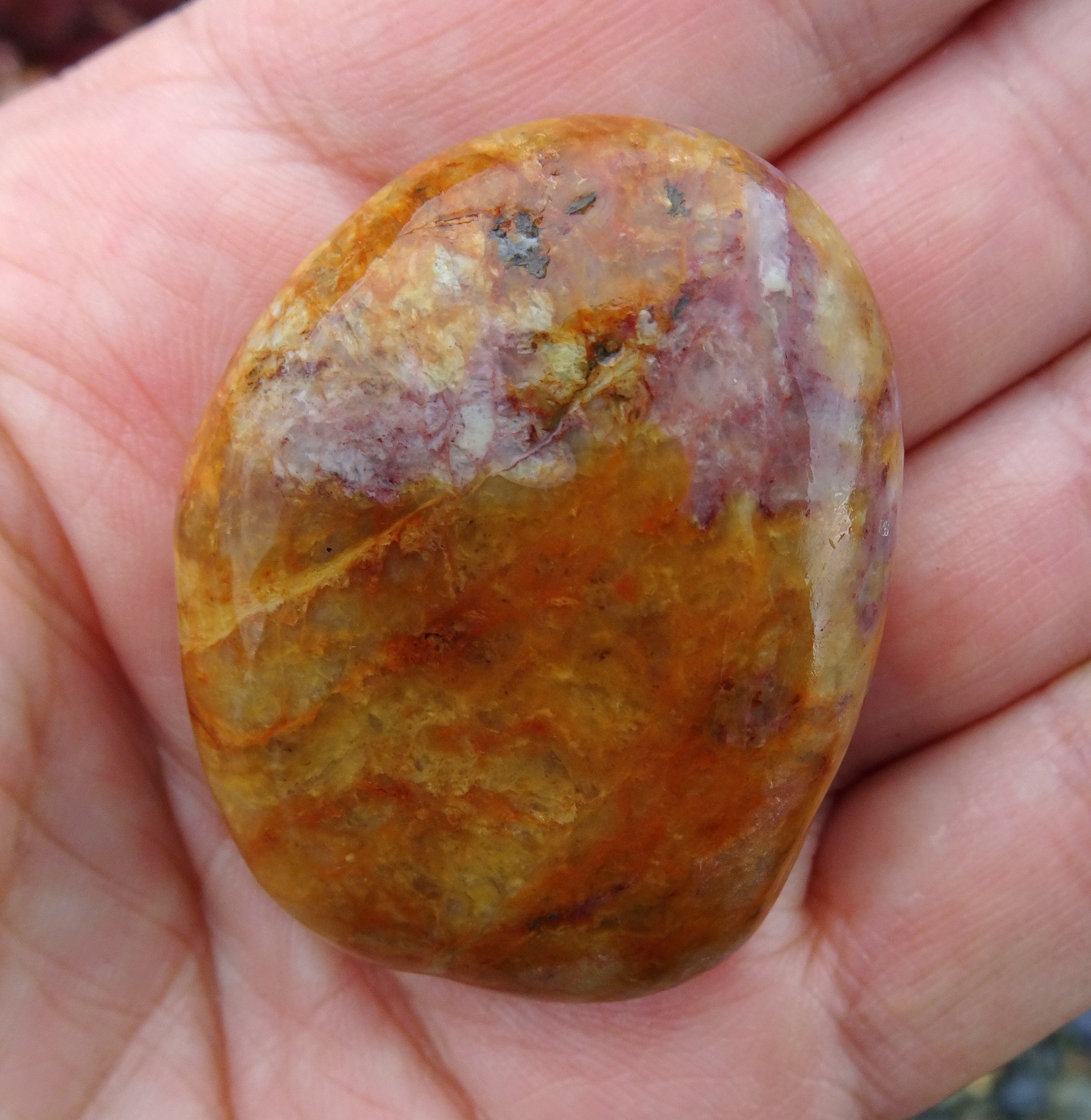 Gorgeous bright stone, with interesting patches of light purple..
