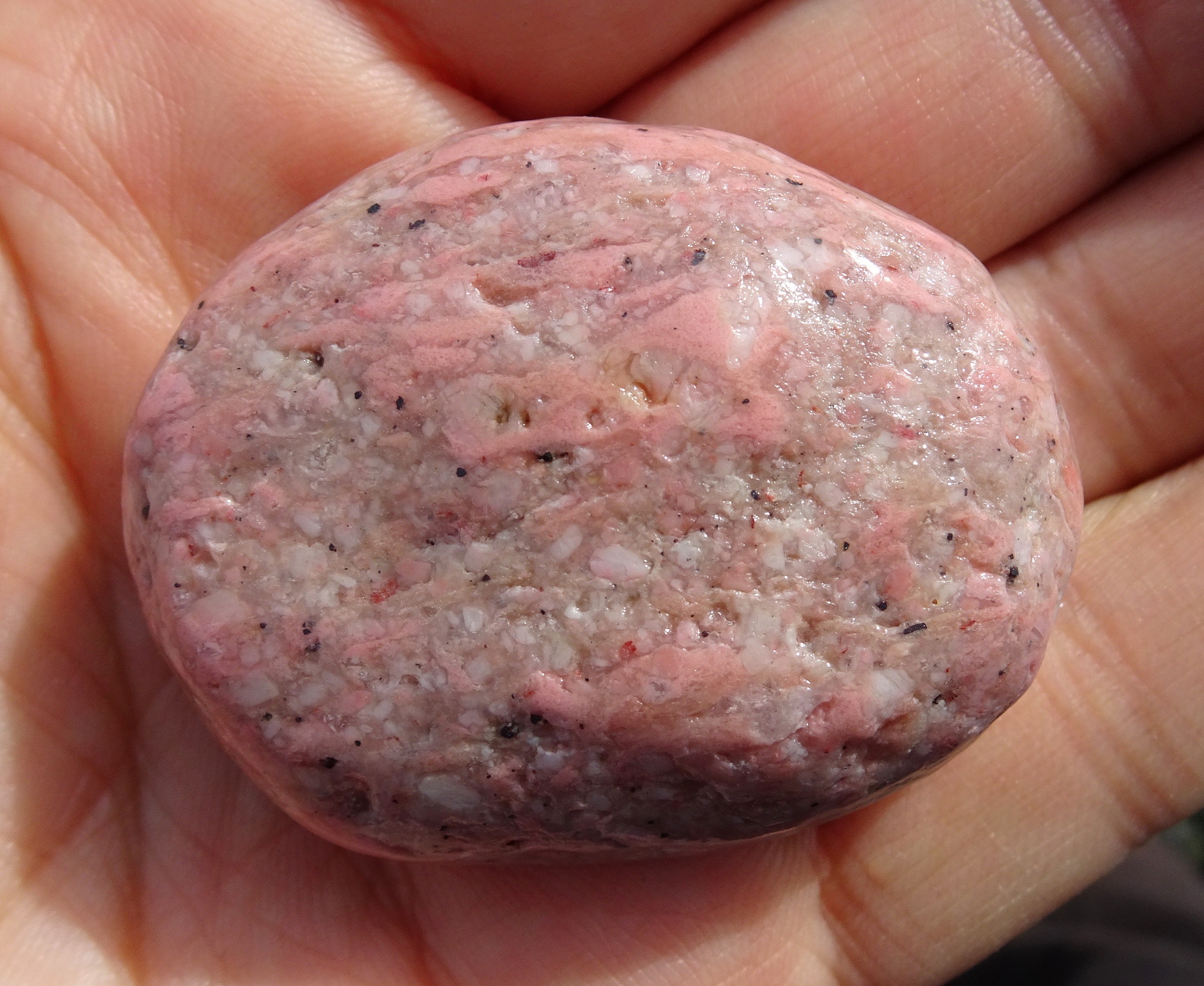 The pink is a mineral called thulite.