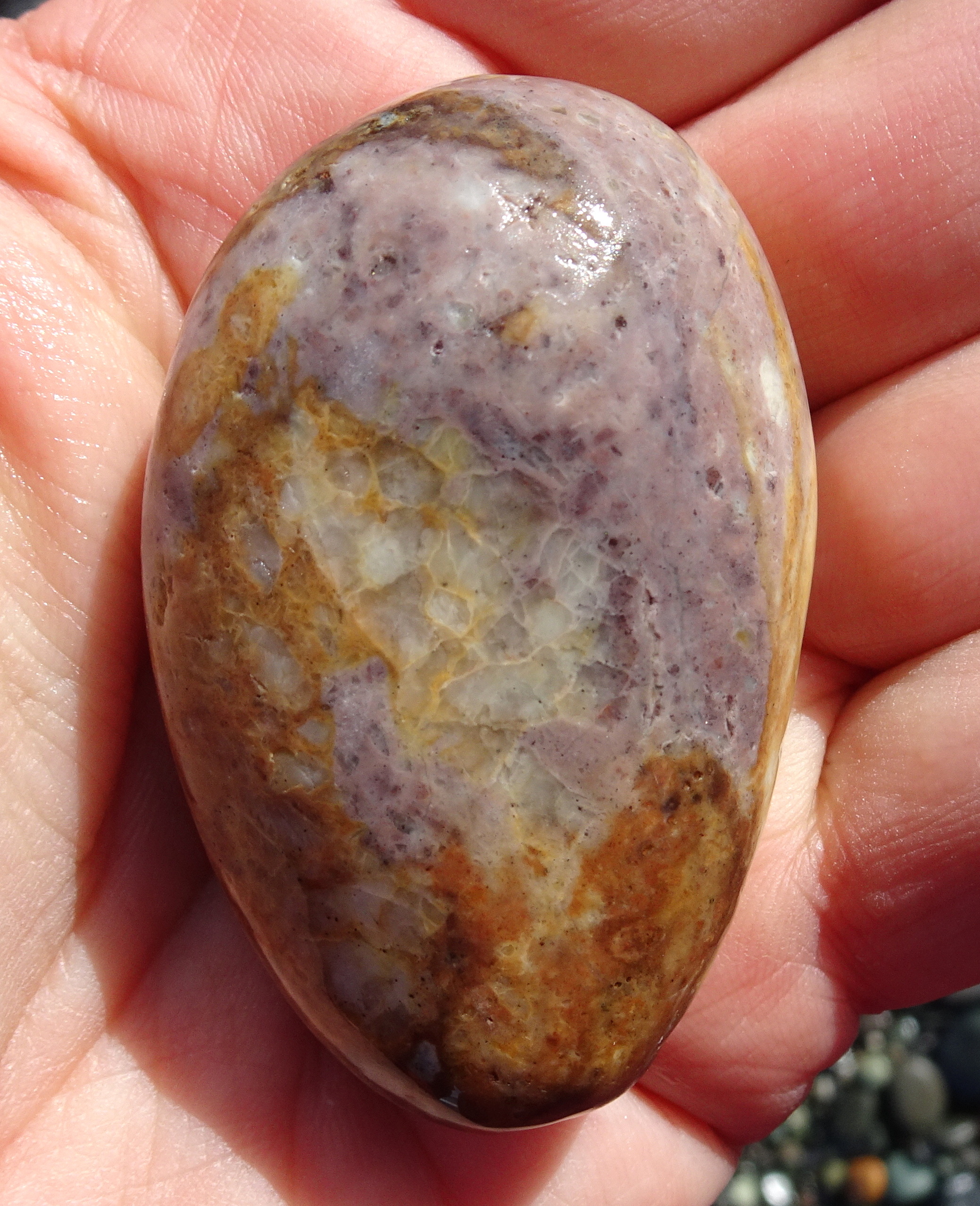 The mauve colour in this stone caught my attention. Probably mineral-stained quartz.