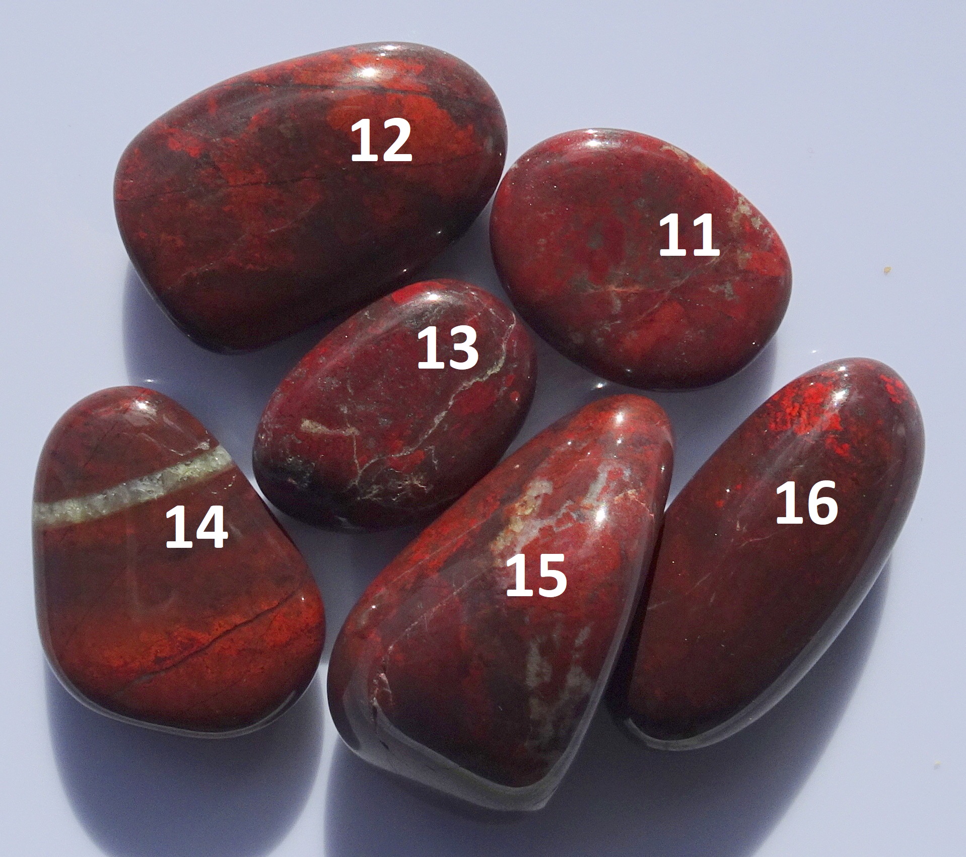 Six polished purple stones from Kakanui.
