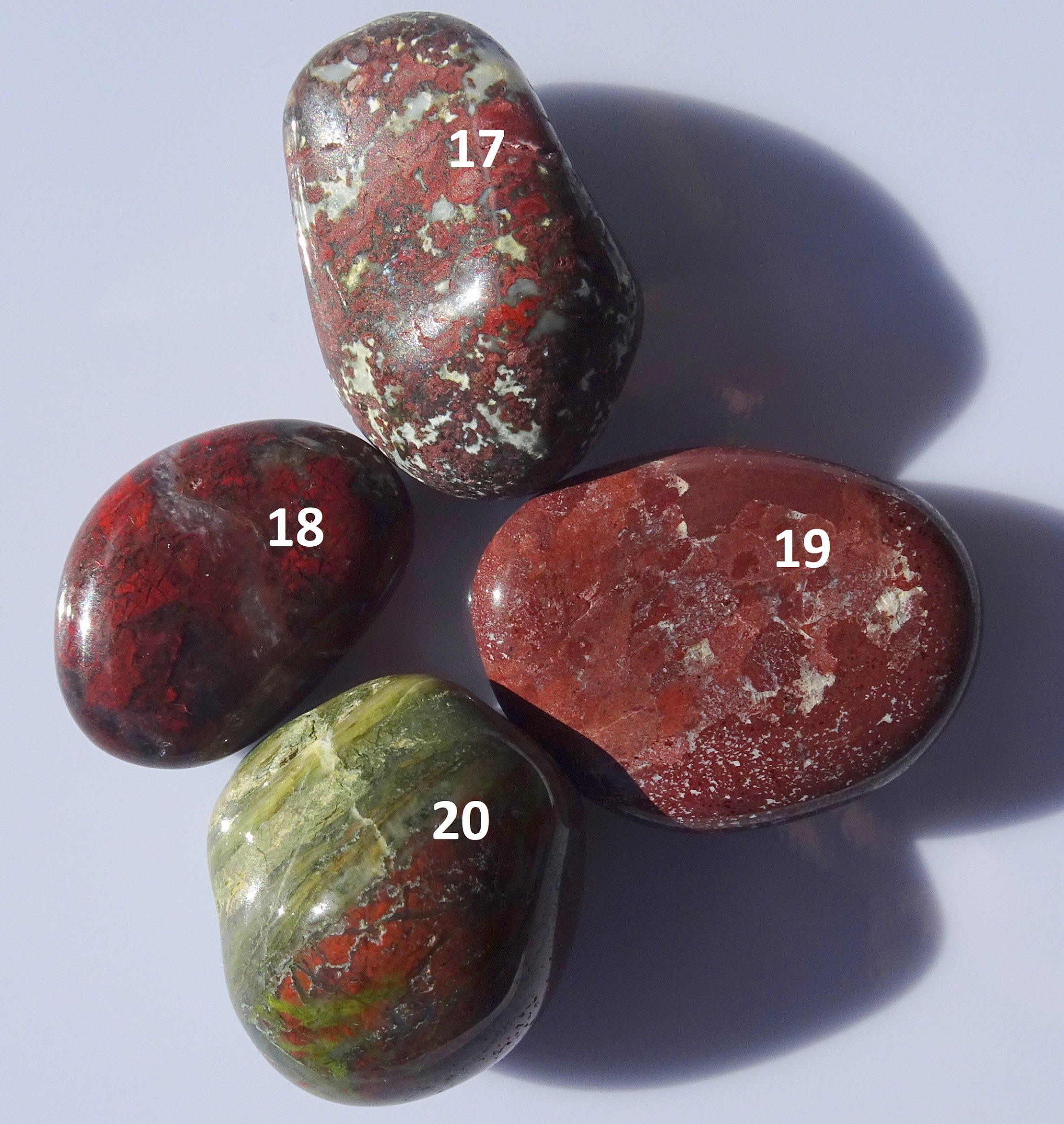Four polished purple stones from Riverton.